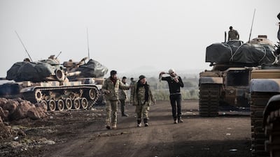 Turkey has been massing its forces on the border with Syria for more than a week in preparation for the attack. Sedat Suna / EPA