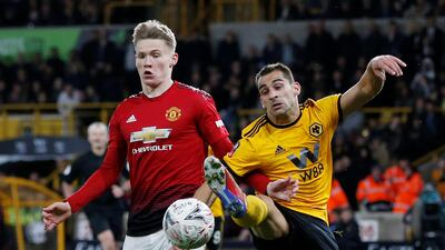 Manchester United's Scott McTominay, left, in action with Wolverhampton Wanderers' Jonny Castro. Reuters