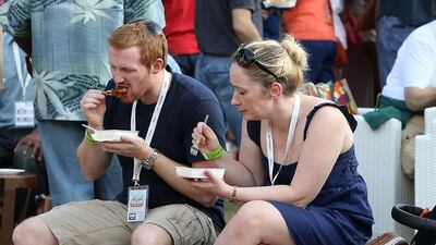 People trying food at different restaurants at the Taste of Abu Dhabi. Pawan Singh / The National