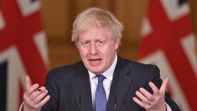 UK Prime Minister Boris Johnson gestures as he speaks during a media briefing on coronavirus (COVID-19) at Downing Street, London, England. Getty Images