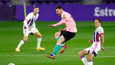 Lionel Messi in action with Real Valladolid's Nacho. Reuters