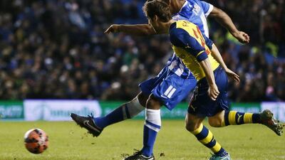 Brighton's Chris O'Grady, far, scores his side's first goal against Arsenal in their 3-2 loss in the FA Cup on Sunday at the Amex Stadium in Brighton. Stefan Wermuth / Reuters
