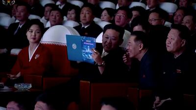 Mr Kim and his wife later took to the stage to shake hands and take a photo with the artists.