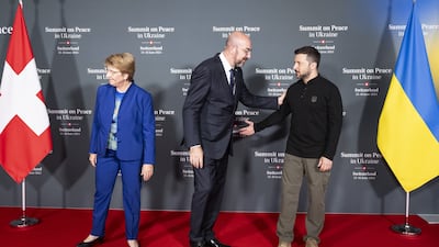 Swiss Federal President Viola Amherd, left, with Charles Michel, President of the European Council, centre, and Mr Zelenskyy. EPA