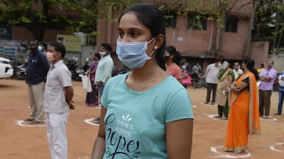 People maintain physical distancing protocols while waiting to register for a vaccination programme against Covid-19 in Hyderabad. AFP