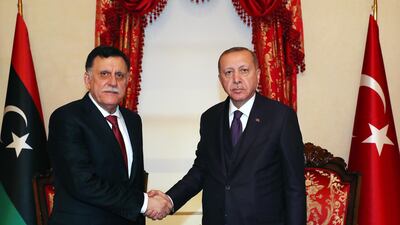 Recep Tayyip Erdogan, right, shakes hands with GNA's Fayez Al Sarraj during their meeting in Istanbul last month. EPA