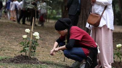 A family member reacts after laying a flower during a memorial ceremony for the victims of the Ethiopian Airlines Flight ET302 plane crash, at the French Embassy in Addis Ababa, Ethiopia. Reuters