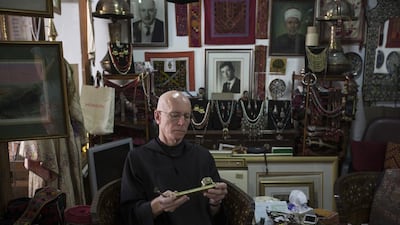 Father Columba Stewart examines an artefact in Jerusalem on a visit to arrange the digitization of ancient Muslim and Christian manuscripts, for the Hill Museum and Manuscript Library. HMML has preserved more than 50,000 manuscripts in the past 13 years. Matilde Gattoni for The National
