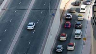 A frustrated driver speeds illegally over the Greens flyover to escape congestion in the Al Barsha of Dubai.