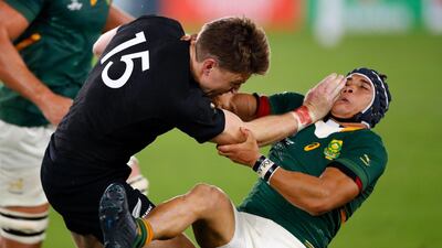 New Zealand's full back Beauden Barrett (L) attempts to run past South Africa's wing Cheslin Kolbe during the Japan 2019 Rugby World Cup Pool B match between New Zealand and South Africa at the International Stadium Yokohama in Yokohama. AFP