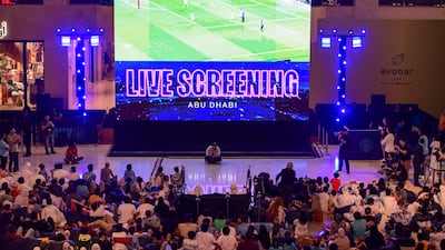 Fans at Yas Mall in Abu Dhabi watch Manchester City win the Champions League final. Khushnum Bhandari / The National