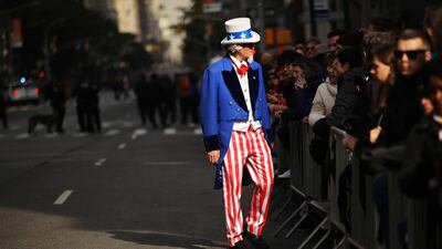 A man dressed as Uncle Sam marches in the Veterans Day Parade. AFP