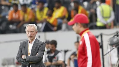 Saudi Arabia manager Bert van Marwijk shown opposite UAE manager Mahdi Ali during the teams' last encounter in Abu Dhabi in March. Ali Haider / EPA