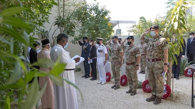 The sombre occasion marked the formal restoration of the church graveyard with 12 new tombstones built for fallen servicemen. Ruel Pableo for The National