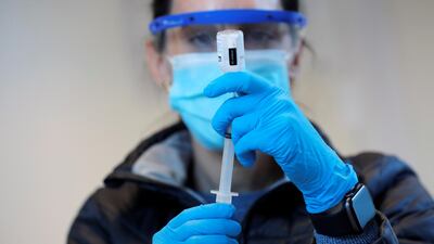 Nurse practitioner Sarah Gonzalez prepares to give a dose of the coronavirus Moderna vaccine at a mass vaccination site at Brooklyn Army Terminal in New York City, New York, US. Reuters