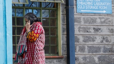 Ms Syedah talks on her mobile phone outside the mortuary. Reuters