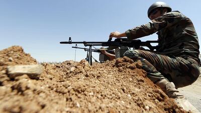 Peshmerga fighters from Iraq's autonomous Kurdish region take positions in the town of Al Muafakiya on June 14, 2014. Karim Sahib / AFP Photo