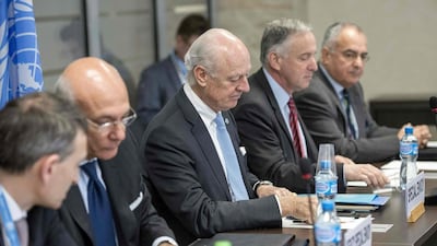 UN special envoy for Syria Staffan de Mistura, centre, during negotiations between the Syria's regime-tolerated opposition and the UN, at the European headquarters of the United Nations in Geneva, on April 27, 2016. Russia has asked the UN to blacklist a major rebel group that is playing a key role in peace talks to end the Syrian civil war, its ambassador to the UN said. Martial Trezzini/AFP