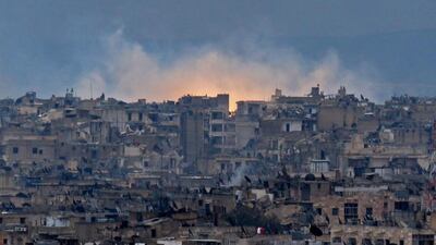 Smoke and flames rising from buildings in Aleppo's southeastern Al Zabdiya neighbourhood following government strikes on December 14, 2016. AFP