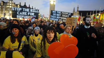 Demonstrators gathered in Parliament Square in London on Monday evening to protest against the Illegal Migration Bill. PA