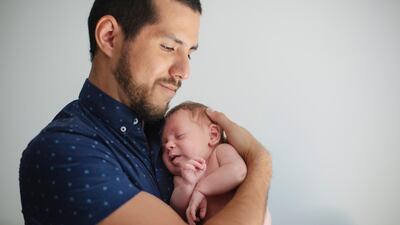 Fathers will be able to take up to five days paternal leave in the UAE after a new ruling was introduced. Getty Images