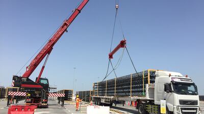 Towering Expo entry portals transported at night on trailer trucks from Germany to Antwerp and shipped to Jebel Ali and onto the Expo site in Dubai.