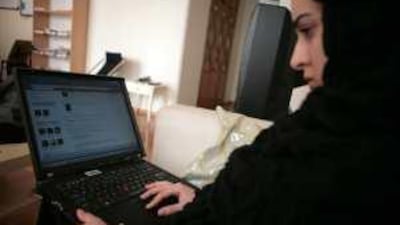 A 21-year-old Iranian women looking at her Facebook page at her home in Tehran.