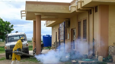 A worker disinfects a rural isolation centre where patients are being treated for cholera in Wad Al Hilu, in Sudan's eastern Kassala state. AFP