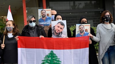 Anti-government protesters and families of Beirut blast victims rally in support of the Public Prosecutor, judge Tarek Bitar, in Beirut. EPA