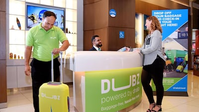 Travellers flying with select airlines from Dubai Airport can now check-in and drop luggage at The Dubai Mall's Dubz Dnata station. Courtesy Dnata Travel