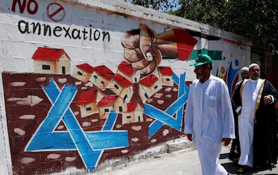 A mural against Israel's plan to annex parts of the West Bank on the main road of Rafah refugee camp in Gaza. AP
