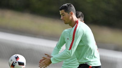 Portugal's Christiano Ronaldo exercises with the ball during a training session in Marcoussis, near Paris, France, Wednesday, June 29, 2016. Portugal will face Poland in a Euro 2016 quarter final soccer match in Marseille on Thursday, June 30, 2016. (AP Photo/Martin Meissner)