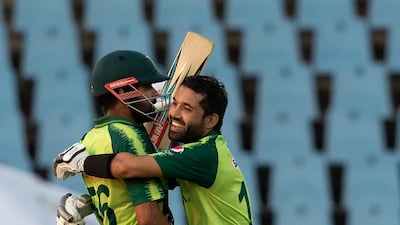 Pakistan's captain Babar Azam, left, celebrate with teammate Mohammad Rizwan after scoring a century during the third T20 against South Africa at Centurion Park on Wednesday, April 14, 2021. AP