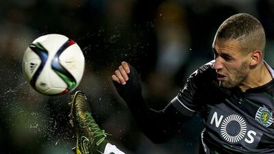 Islam Slimani, right, of Sporting CP heads in a goal against Vitória Setubal in Portugal. Jose Sena Goulao / EPA