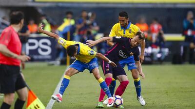 Barcelona midfielder Ivan Rakitic duels for the ball against Las Palmas’ Helder Lopes. Lucas de Leon / AP Photo