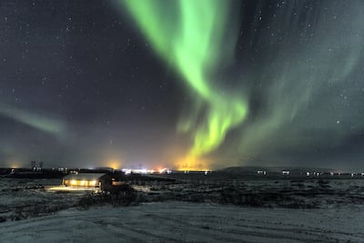 Green Aurora Borealis light up the sky at Selfoss near Reykjavik Sophia Groves/Getty Images