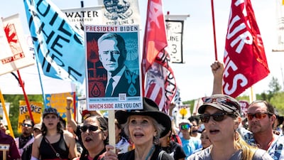 Actress Jane Fonda, centre, joins fellow climate activists during a rally in Solway, Minnesota, the US. AFP