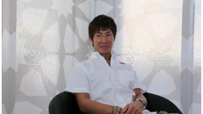 Kamui Kobayashi relaxes at Yas Marina Circuit. Pawan Singh / The National