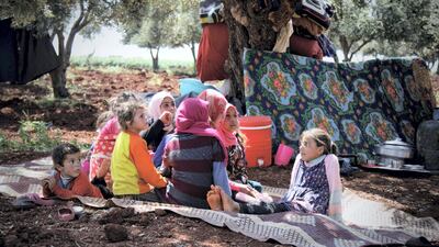 Mustaf's sons, Tala( the girl) Mohammad and Jaber in the back standing on the soil in Harm's mountain.