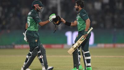 Pakistan's Imam-ul-Haq, right, celebrates with teammate Babar Azam after scoring a century. AFP