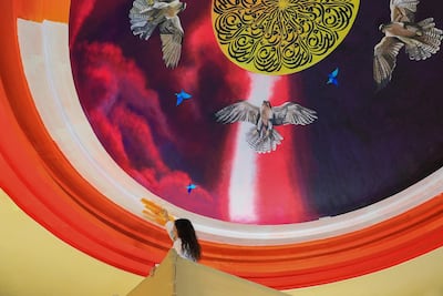 Amalie Beljafla working on her mural 'Al Noor'