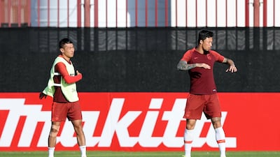 Yu Han Chao, left, and Zhang Lin Peng, right, of China train before the start of the Asian Cup at Al Wahda Academy in Abu Dhabi.