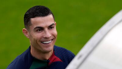 Cristiano Ronaldo smiles as he arrives for a team training session in Oeiras, outside Lisbon. AP Photo