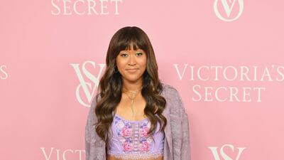 Naomi Osaka wears a mismatched cropped top and mini skirt, though redeems the look with an oversized cardigan. AFP