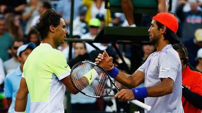 Fernando Verdasco, right, and Rafael Nadal greet each other at the net after their Miami Open third round match. Al Bello / Getty