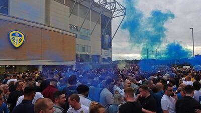Leeds United supporters gather outside their Elland Road ground to celebrate the club's return to the Premier League after a gap of 16 years. AFP