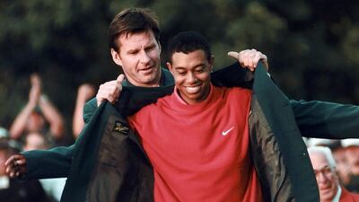 Tiger Woods won his first Masters title in 1997. The 2014 tournament will be the first one he has missed in his career as he recovers from back surgery. Dave Martin / AP