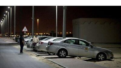 Cars belonging to Q Link are parked outside a compound in Khalifa City B in Abu Dhabi where the company's drivers live. Q Link's parent company has said the taxi operator is to be closed down.