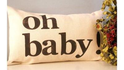 The Oh Baby cushion cover from US brand Joshua by Oak is made of 100 per cent heavyweight ivory cotton fabric.