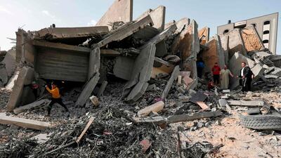 A man looks at a damaged building in Gaza City. AFP